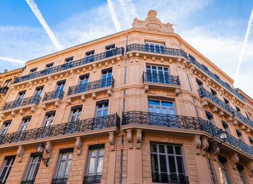 Facades of a building in the city centre of Toulouse, in Occitanie, France.