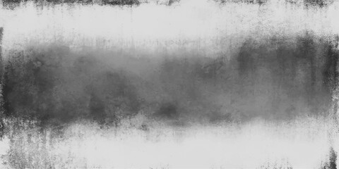 A dark and moody morning landscape where thick white mist and fog drift over the lake and through the forest trees under a cloudy sky © hossain