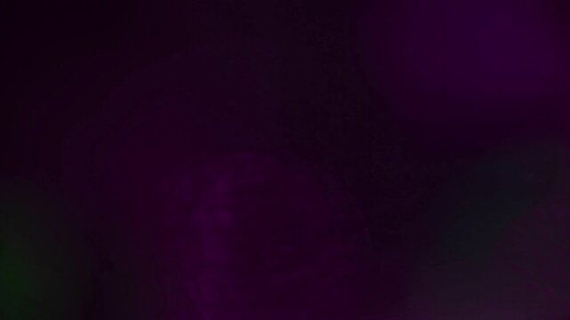 Light leak and bokeh overlay with purple and green hues, creating a dreamy and ethereal effect. Perfect for adding a magical touch to your projects.