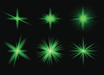 Fototapeta premium Glowing green starburst effects on black background