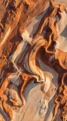 Stunning aerial view of desert sand dunes with vibrant orange and white hues