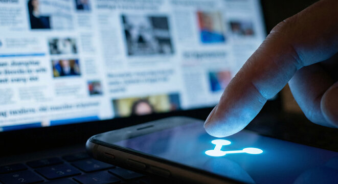 Close-up of a finger hovering over a share icon on a phone