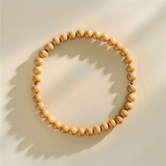 Obraz premium Minimalist Wooden Bead Bracelet Circle on Neutral Background with Shadow