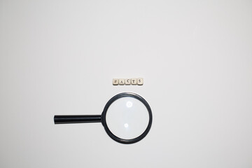 Magnifying glass beside the word facts on minimal white background. Symbol of investigation, fact...