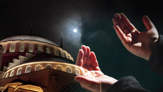 Islamic concept video. Camlica Mosque with praying hands. Laylat al-qadr or kadir gecesi background video.
