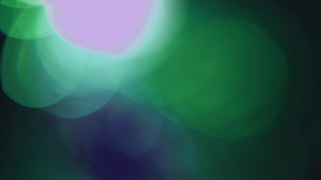 light leak and bokeh overlay with green and purple hues, creating a magical and ethereal effect. This is perfect for adding a dreamy atmosphere to your projects.