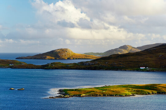 View S from near Allt Chrisal, Barra, to Vatersay near south tip of the Outer Hebrides, Scotland. Near start of Hebridean Way long distance walk