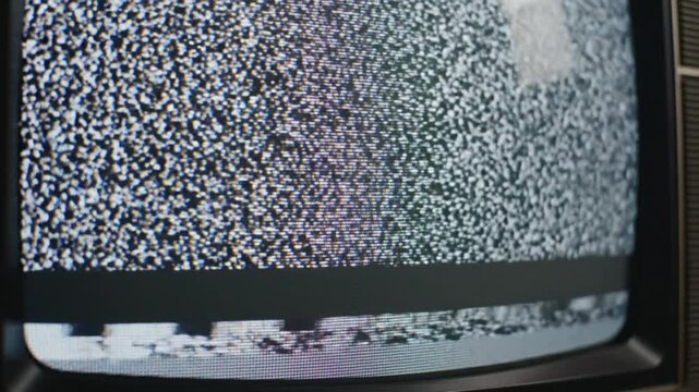 Old television screen showing white noise static with no signal