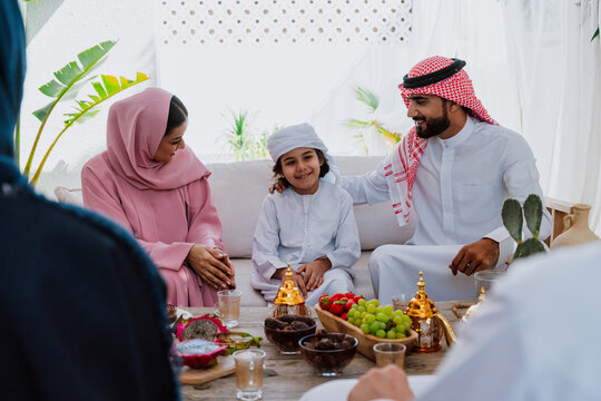Emirati family at home. Muslim family sharing iftar at countryside home.