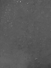 Obraz premium High-angle view dark grey surface with white sparkling dots