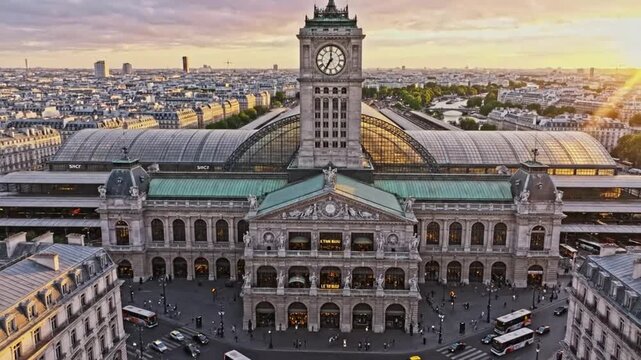 Travel to Paris as you explore the busy Gare de Lyon train station at sunset with people and cars moving around the area