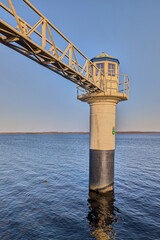 A former water level gauge house in Lauwersmeer Oostmahorn Friesland Netherlands serves as a maritime landmark for water management and coastal protection guiding safe passage on a clear spring