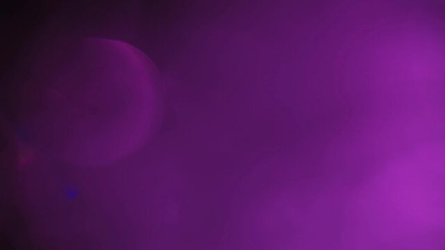 light leak and bokeh overlay with vibrant purple hues, perfect for adding atmospheric effects to video projects. This footage is ideal for transitions or enhancing mood.