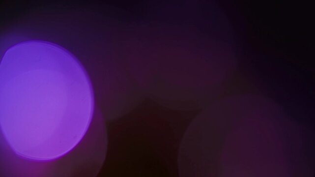 Light leak and bokeh overlay with purple and pink hues, creating a dreamy, ethereal effect. This video is perfect for adding a creative flair to projects.