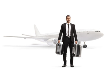 Businessman carrying suitcases and traveling by plane