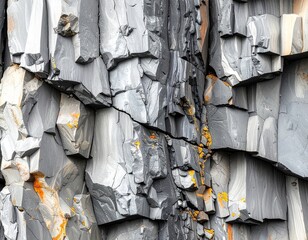 Basalt Columns Rock Formation With Orange Lichen and Cracks in Iceland