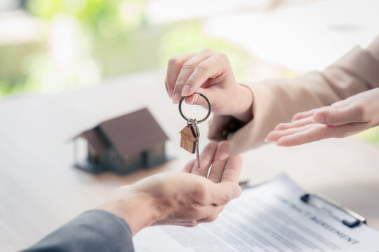 Real estate agents hand over the keys to a property to clients after they sign a lease agreement for an apartment or house with the landlord. Real estate agents also handle mortgage loan agreements wi