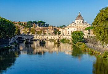 Fototapeta premium St Peter's basilica in Vatican and St. Angel bridge over Tiber, Rome, Italy