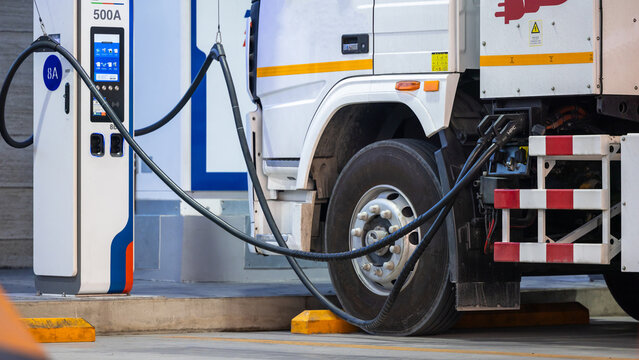 EV charging and semi truck electric vehicle, Electric vehicle semi truck trailer charging station for charge EV battery, Plug for vehicle electric engine, EV charger semi truck trailer station.