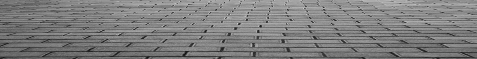 Perspective block pavement or herringbone brick tile floor walkway. Perspective concrete block pavement. City sidewalk block or the pattern of stone block paving.