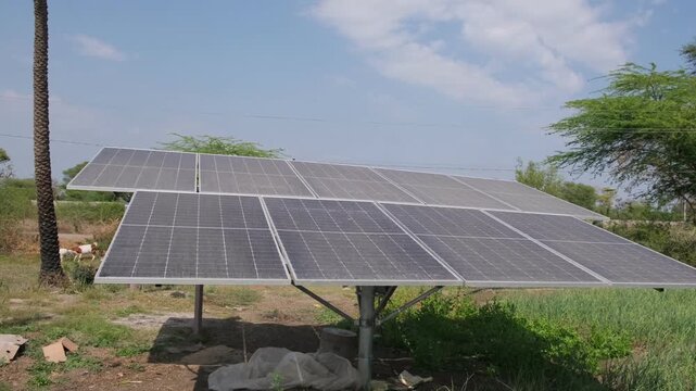 Large solar panel array installed in a rural field for sustainable farm energy