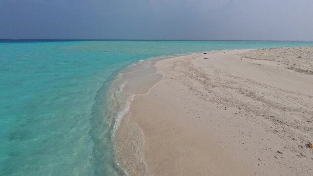 Maldives Sandbank Island in Turquoise Lagoon with White Sandy Beach