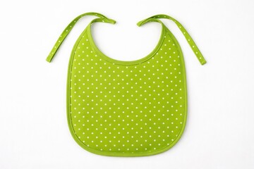 Green baby bib with white polka dots and green ribbon ties isolated on white