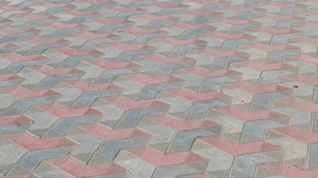 High angle view of colorful interlocking pavement blocks in a geometric pattern