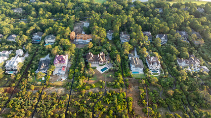 Fototapeta premium Panoramic Aerial view of beachfront mansion homes along Kiawah Island landscapes near Charleston, South Carolina showcasing the lowcountry coast and natural beauty