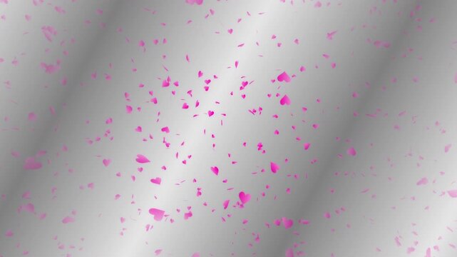 Pink heart shapes being lit up and falling down on silver gradient moving background. Abstract background for Happy Valentine's day and wedding ceremony.