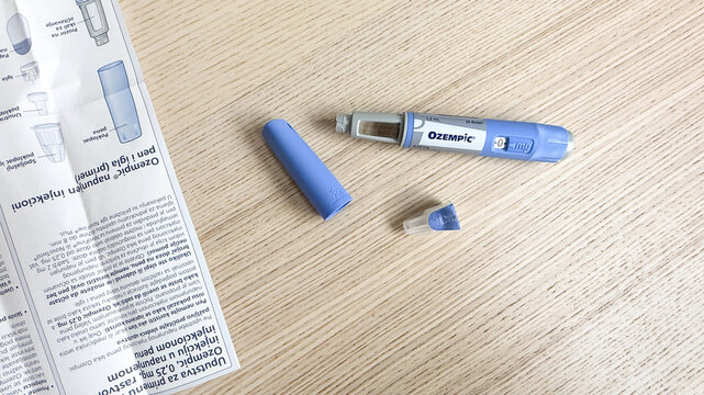 Medical device artfully unassembled on oak table topa nod to World Health Day and innovative healing practices  Ozempic, GLP 1, Semaglutide, January 5 2026, Subotica, Serbia