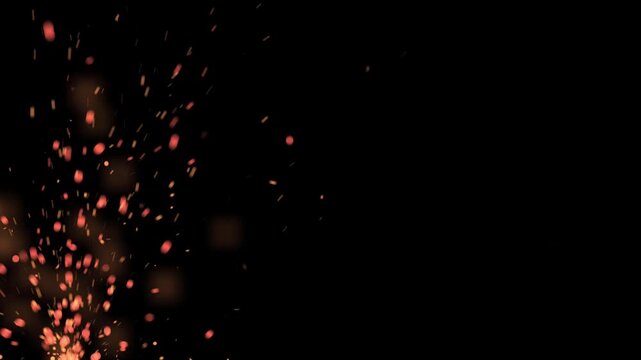 Rising fire embers and glowing orange sparks flying on a dark black background for visual overlays