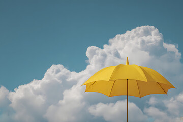 Obraz premium In a blue sky with clouds, a yellow umbrella is present.