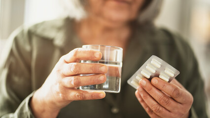 Taking medicine from blister pack