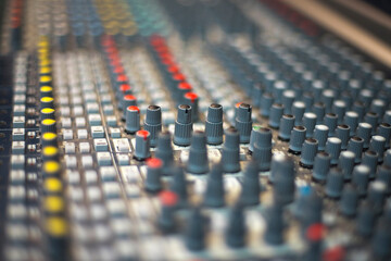 Fototapeta premium Perspective View of Professional Multi-Channel Audio Mixing Desk Surface