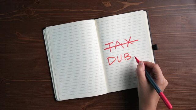 Tax free Dubai, Tax planning and financial compliance concept with handwritten notes in diary on desk