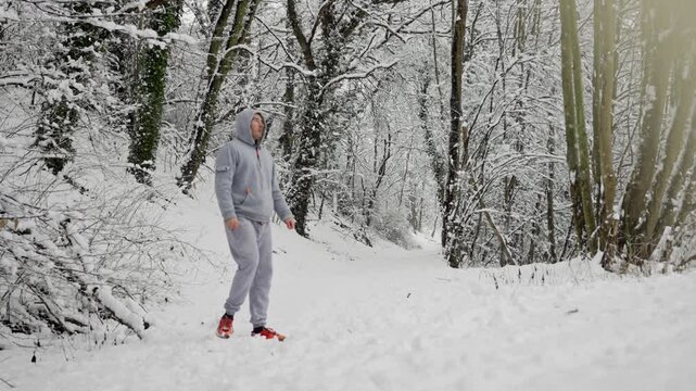 Silent Winter Watch. Man Observes Icy Forest Serenity. Individual Observes Peaceful Frozen Forest From Boundary Edge. Person In Hood Gazes Silently Over Tranquil Icy Woods From Forest Boundary