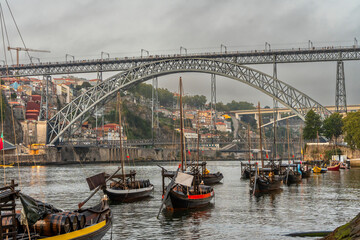 Historic Porto with Traditional Rabelo Boats and Iconic Bridge
