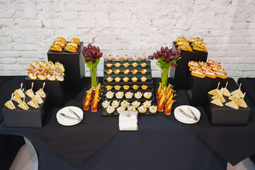 Child holds adult hand during special moment at celebration