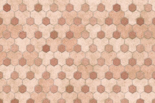 Warm peach and pink stone hexagonal tile texture for elegant and soft interior design backgrounds