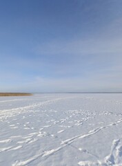 frozen snow-covered large lake