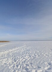 frozen snow-covered large winter lake

