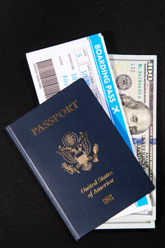 US passport with boarding pass and dollars. Travel documents for airport check in and international flight concept. American passport and money theme. Boarding pass and payment card.