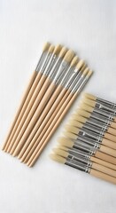 Fototapeta premium Bundle of unsharpened wooden pencils on white wooden background minimalist flat lay