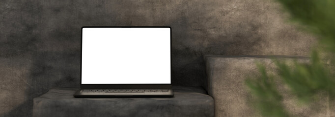 3D Blank laptop screen mockup placed on stone stand with textured wall Responsive Web Design