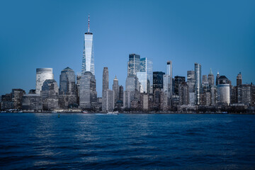 Obraz premium New York NYC skyline scenic river view. New York City skyline iconic panorama. New York Manhattan skyline photography scene. New York NYC skyline modern American city.