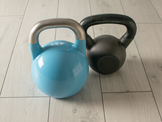 Pair of Kettlebells on Wooden Floor for Fitness and Strength Training