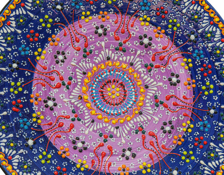 Background with Tunisian traditional ceramic in the plate form, painted with specific patterns.