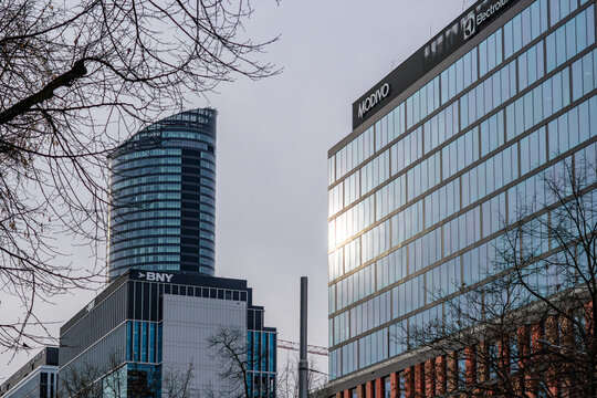 Modern business architecture in Wroclaw, MODIVO and BNY Mellon office buildings with Sky Tower in the background, glass facades of corporate headquarters in the city center.