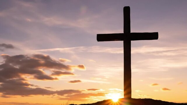 Powerful silhouette of a holy cross against a vibrant sunset sky. Inspirational religious background for Good Friday, Easter, and spiritual storytelling. Deep colors and moving clouds.